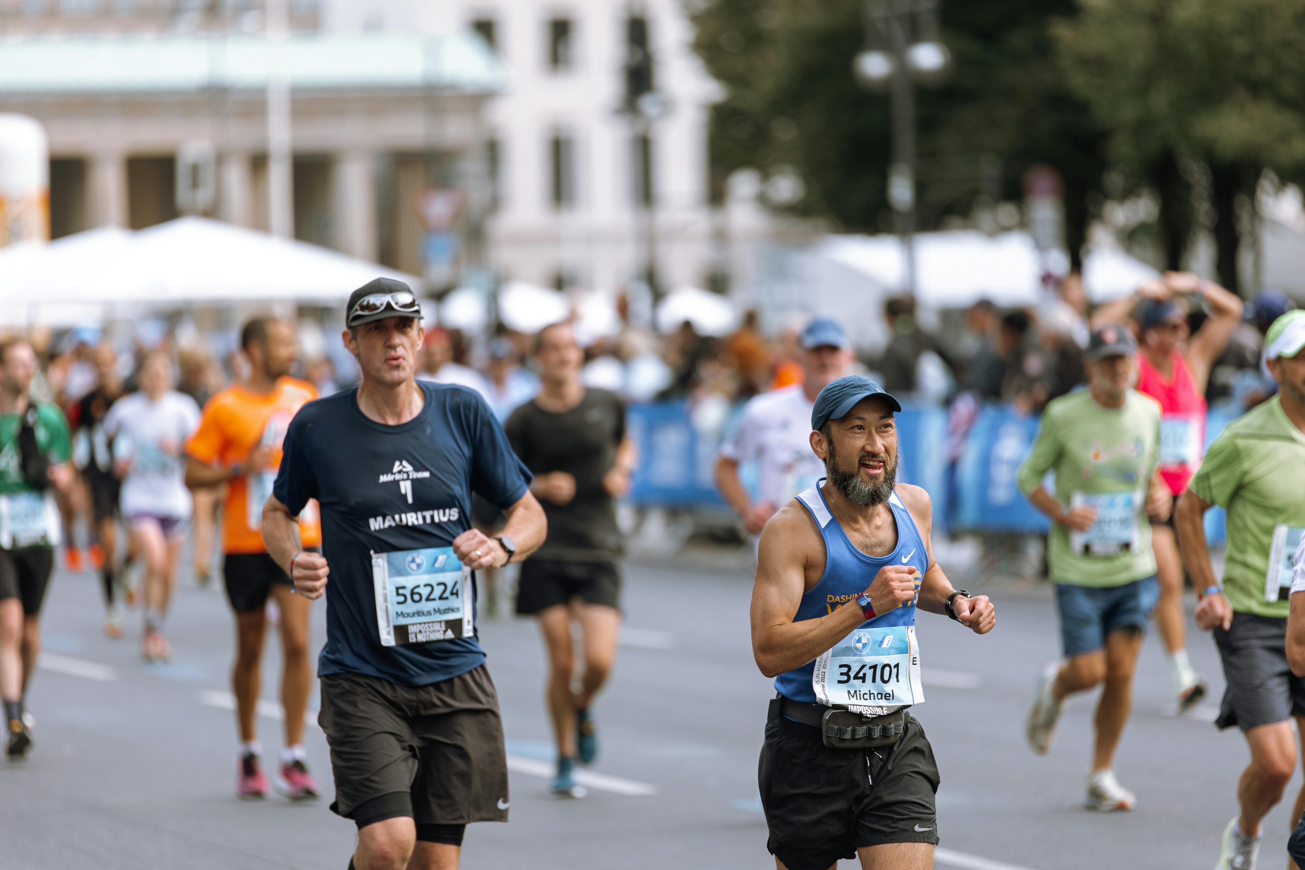 Focused runners competing in a city marathon event, showcasing athletic determination